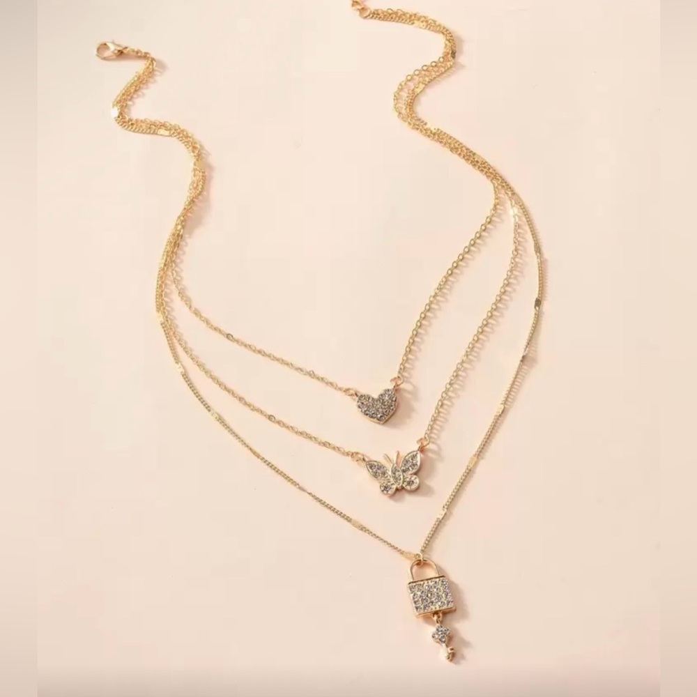 Gold Layered Necklace Set with Heart, Butterfly, and Lock Pendants - Picture 4 of 6